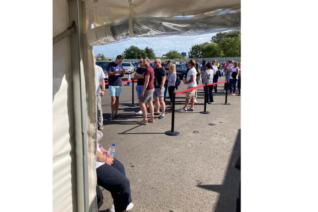 People queue for Covid test to board Scarlet Lady. Picture: Claire Perry