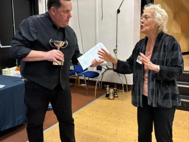 John Palmer, Director of Spinnaker, receiving the Gordon Neave Trophy from the adjudicator Julia Dewhurst.