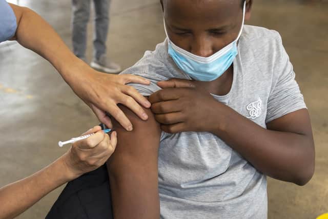 Feysal Woliyi, 24, from Southsea has his first Covid vaccination at Cosham fire station. Picture: Mike Cooter (300721)