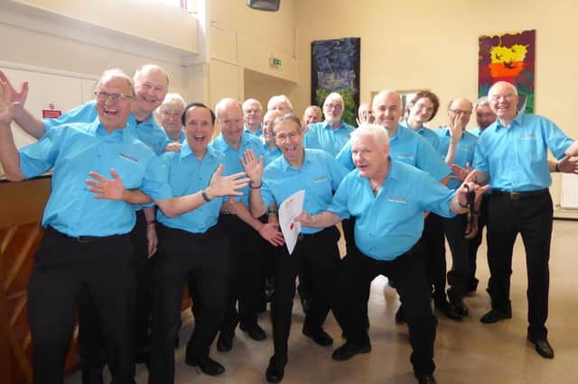 Solent City Chorus celebrate winning an award at the Chichester Music Festival