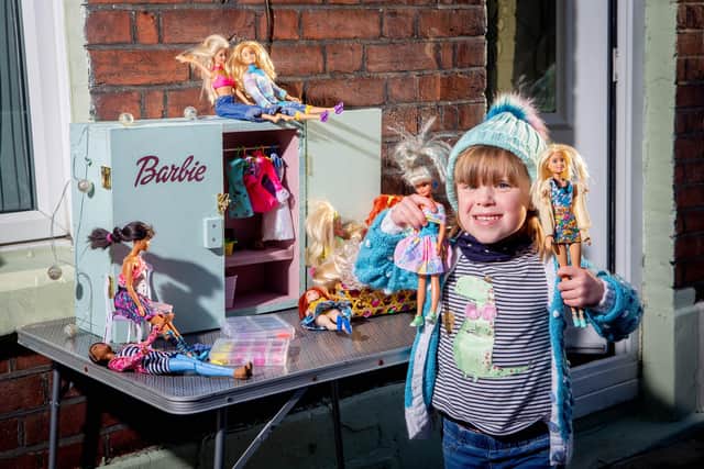 Alexa Prior, 4 with her dolls and her doll wardrobe outside her home in Fratton, Portsmouth. Picture: Habibur Rahman