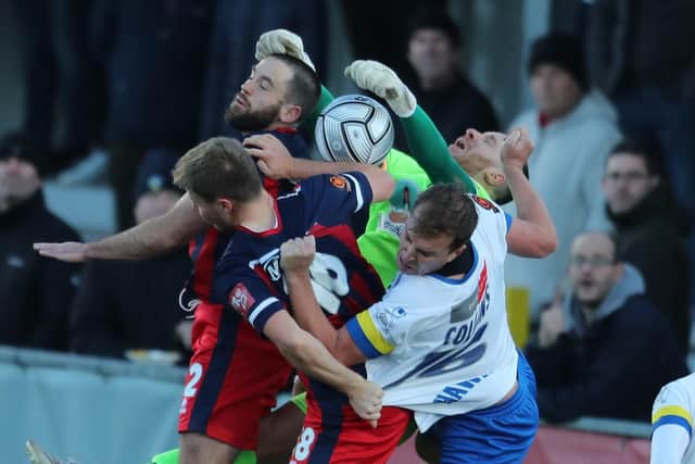 Jamie Collins is crowded out at a set piece Picture: Dave Haines