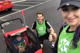 Ben Brooks is taking on a mile each day for 21 days using various methods of unusual transport to raise funds for Portsmouth Down Syndrome Association's T21 Challenge. Pictured: Ben with his wife Stacey and their son William, two