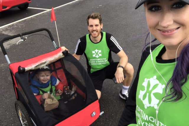 Ben Brooks is taking on a mile each day for 21 days using various methods of unusual transport to raise funds for Portsmouth Down Syndrome Association's T21 Challenge. Pictured: Ben with his wife Stacey and their son William, two