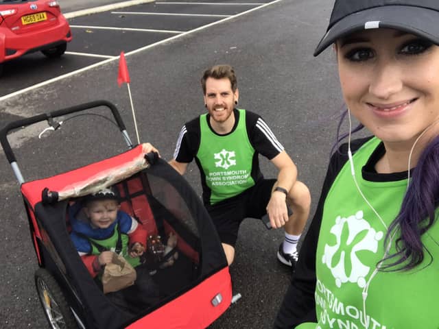 Ben Brooks is taking on a mile each day for 21 days using various methods of unusual transport to raise funds for Portsmouth Down Syndrome Association's T21 Challenge. Pictured: Ben with his wife Stacey and their son William, two