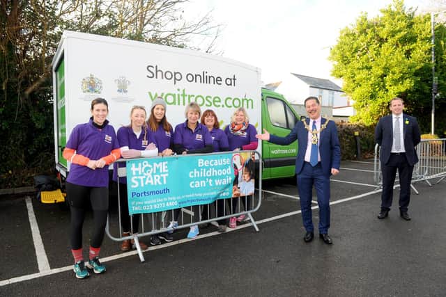 The Home-Start Portsmouth team left Waitrose in Marmion Road, Southsea, on Tuesday, December 8. The 15 mile walk fundraising walk around Portsea, was for the John Lewis & Partners Give A Little Love campaign.Pictured is: (l-r) Rachel Benjamin, Rachael Hulks, Amy Baines, Jacqui Leighton, Heidi Taylor and Jo Toms from Home-Start Portsmouth, with the Lord Mayor of Portsmouth Rob Wood with Waitrose store manager Rhys Evans.Picture: Sarah Standing (081220-9817)