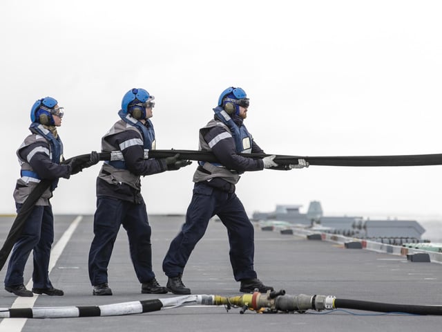 A Merlin Mk2 of 820 Naval Air Squadron carries out Helicopter In Flight Refuelling (HIFR) on HMS Queen Elizabeth