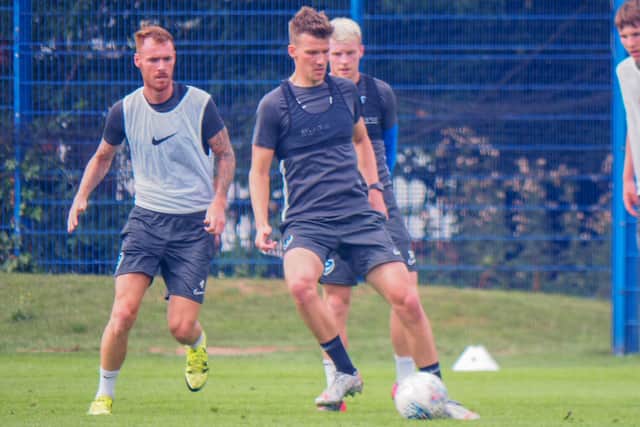 Paul Downing, seen here training with Tom Naylor and Andy Cannon on Monday, is seeking a first-team return. Picture: Habibur Rahman