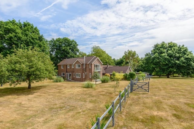 This beautiful home has six bedrooms, three bathrooms and four reception rooms as well as three acres of land.