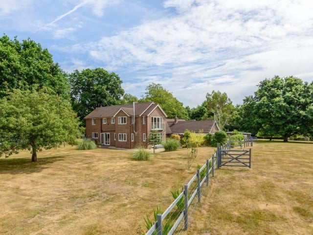 This beautiful home has six bedrooms, three bathrooms and four reception rooms as well as three acres of land.