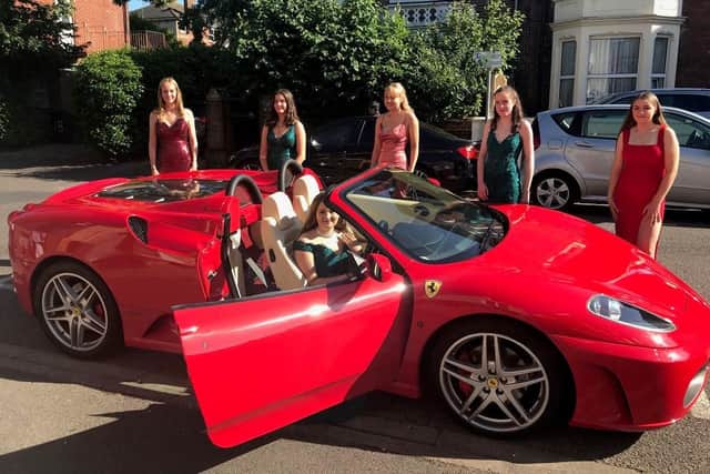 (Pictured left to right)  Madeleine Oliver, 16, Alexandra Cells, 16, Jemima Catt 16, Lauren Sutton, 15, Eleanor Palmer, 16, and Thalia Burke, 16, sitting the Ferrari.