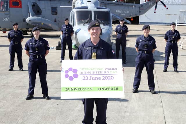 Pictured Captain John Voyce with women engineers based at HMS Sultan.