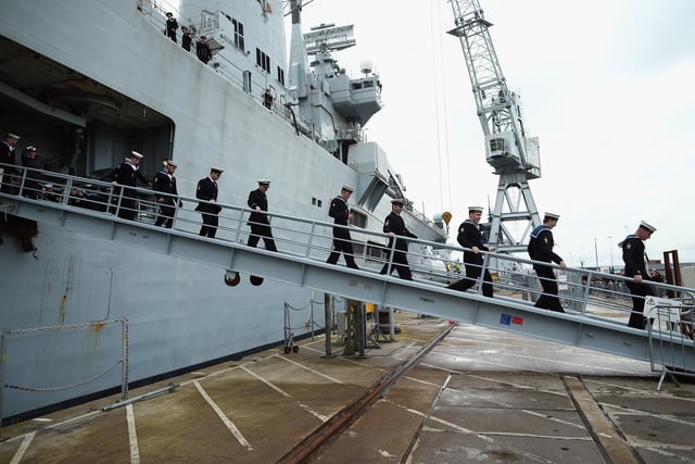 Crew members disembark HMS Illustrious at Portsmouth Harbour on January 10, 2014 in Portsmouth. Photo by Dan Kitwood/Getty Images
