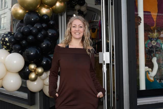 Pictured is: Cacey outside the shop. Picture: Keith Woodland (260221-2)