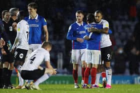 Pompey's Ryan Williams with Peterborough's Jonson Clarke-Harris after the Blues' 2-0 win. Picture: Joe Pepler