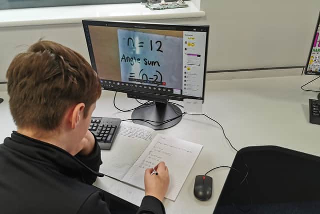 A pupil taking part in a live online lesson