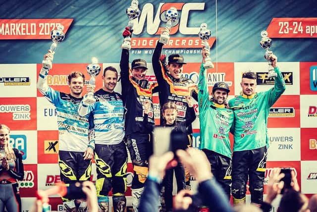 Brett Wilkinson, far right, and passenger Joe Millard, second from right, stand on the podium after achieving a third-placed finish Picture: Vandraq Studio