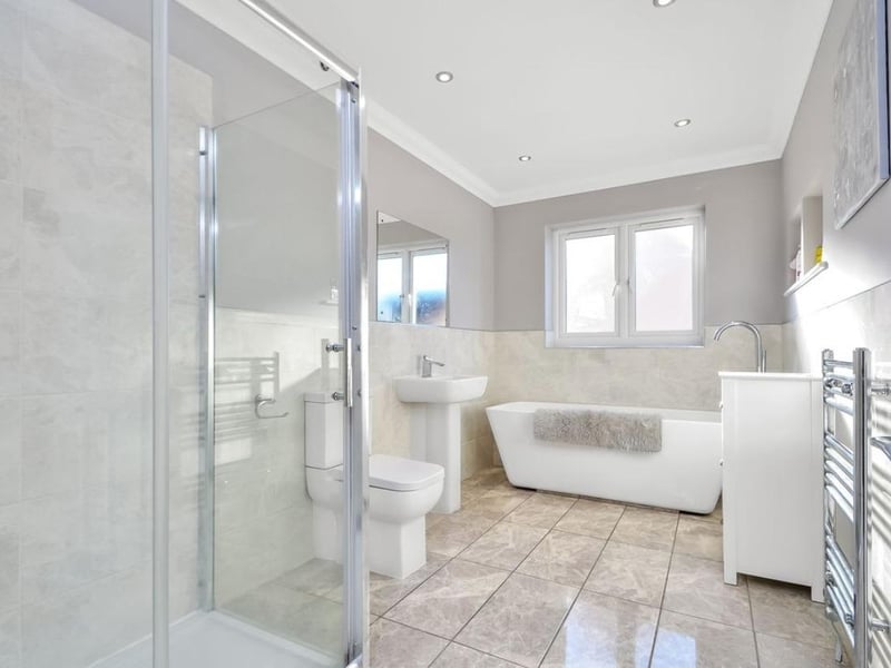 The listing says: "This symmetrical fronted family home is quite unique for the area, being a modern property within an established 1930s."