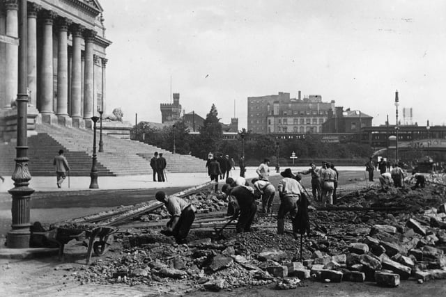 1902: The laying of the electric track for the trams in Portsmouth, outside the Town Hall. (Photo by Hulton Archive/Getty Images)