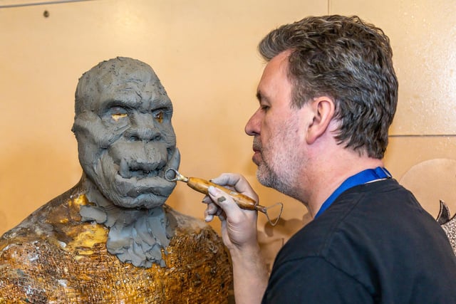 Gary Pollard, 61, a film industry sculptor and animatronics designer, demonstrates his craft