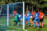 Ryan Wilkins (2) scores Portchester's second goal in their 3-0 Wessex League win at Christchurch. Picture by Daniel Haswell.