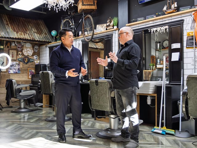 Alan Mak MP with owner Mike Joines at Zoom Barbers in Leigh Park