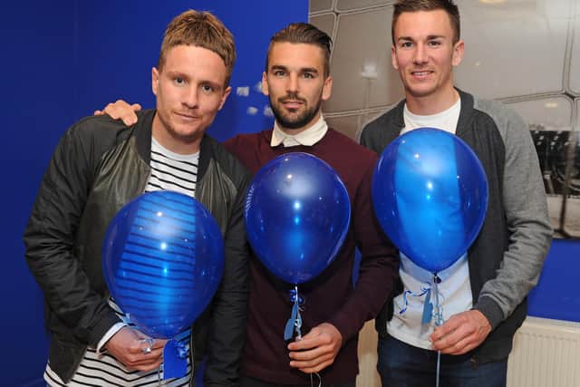 Simon Ferry, Ricky Holmes and Jed Wallace pictured at a Fratton Park balloon release in memory of Jack Robinson in April 2014. Picture: Sarah Standing