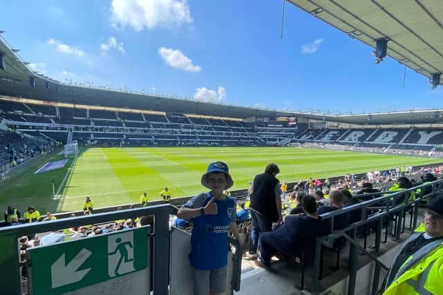 Nine-year-old Ollie Milne pictured at Derby in April. He attended 67 Pompey matches this season.