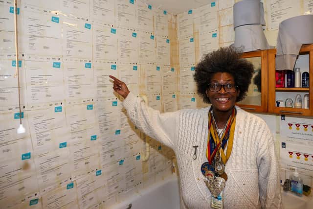 Rosie, who has been diagnosed with Paranoid Schizophrenia at her home in Portsmouth, showing off her collection of certificates and medals on Thursday 30th September 2021. Photos by Alex Shute
