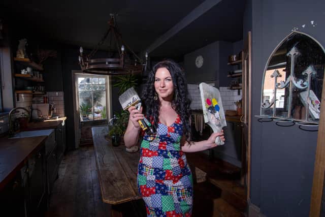 After becoming run down in lockdown, Tilly Marchant decided to redecorate her home for her two children, Marla and Rigby. Pictured: Tilly Marchant in her medieval themed kitchen at her home in Copnor, Portsmouth, on Thursday March 17, 2022. Picture: Habibur Rahman.