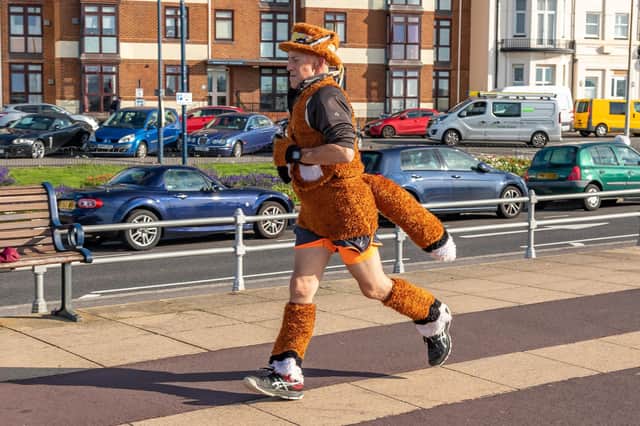 Tim Marney - AKA 'The Fox On Tour' - during the Southsea parkrun. Picture: Mike Cooter