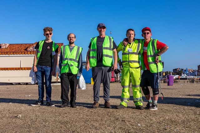 Part of the shift of 35 litter pickers who have been working the site since Sunday night