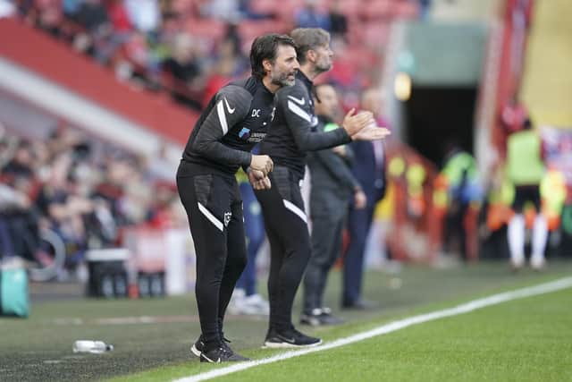 Danny Cowley is seeing pros and cons of his new Pompey system in action. Picture: Jason Brown/ProSportsImages
