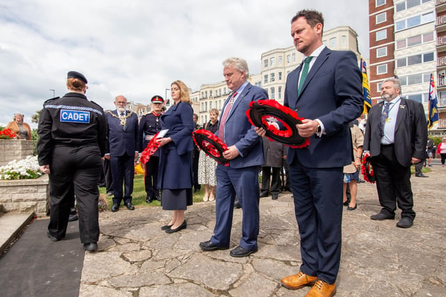 The Portsmouth City Council and Royal British Legion D-Day 75 memorial service on Monday 6th June 2022 at the D-Day Stone, Southsea. Pictured:  Laying of the wreath by MP Penny Mordaunt, Cllr Gerald Vernon Jackson and MP Stephen Morgan.