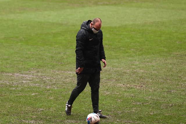 Bobby Madley checks the Valley pitch during his second inspection this afternoon. Picture: Steven Paston