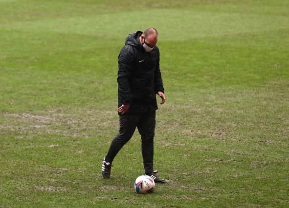 Bobby Madley checks the Valley pitch during his second inspection this afternoon. Picture: Steven Paston