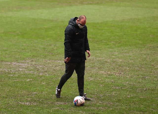 Bobby Madley checks the Valley pitch during his second inspection this afternoon. Picture: Steven Paston