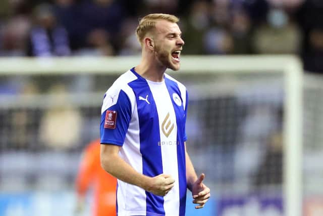 Jack Whatmough is heading towards the Championship with Wigan - and a potential Fratton promotion party. (Photo by Lewis Storey/Getty Images)