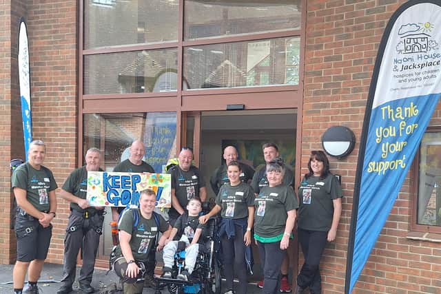 Alfie with his marathon team.