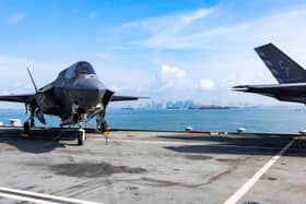 Singapore pictured in the background from the flight deck of HMS Queen Elizabeth. Photo: Royal Navy