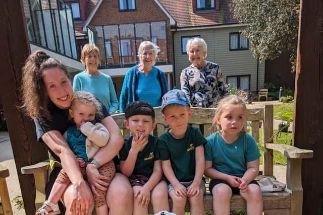 Ancasta Grove residents Beth, Heather and Joan with staff and pupils at Woodlands Early Learning.