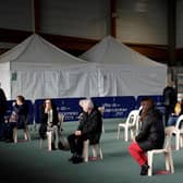 People wait after receiving a dose of COVID-19 vaccine at the vaccination center of Valenciennes, on March 23, 2021. (Photo by Yoan VALAT / POOL / AFP) (Photo by YOAN VALAT/POOL/AFP via Getty Images)