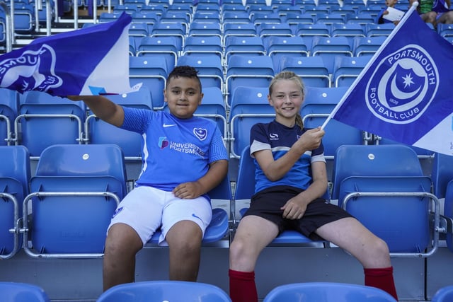 These two young fans settle into their seats before kick-off