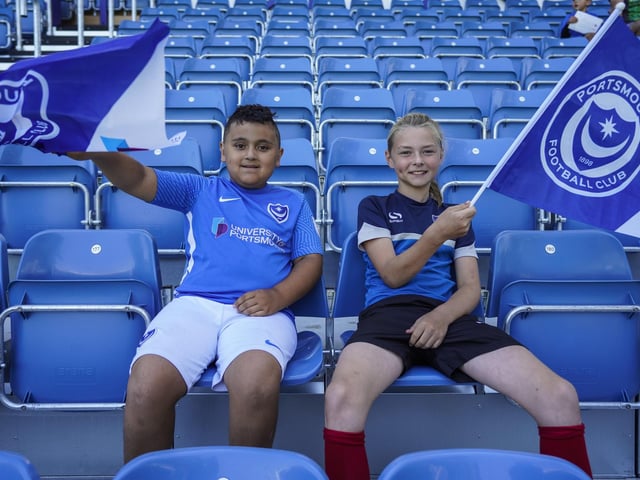 These two young fans settle into their seats before kick-off