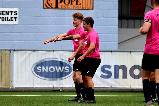 Jack Van Der Lugt, left, celebrates his goal for AFC Trades. Picture: Tom Phillips