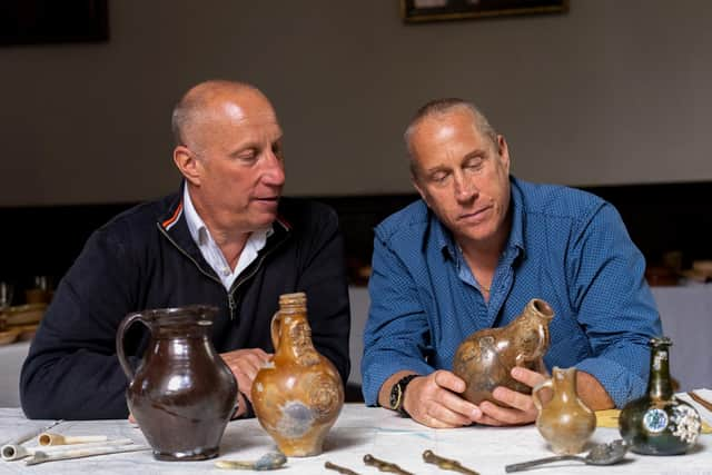 Brothers Julian and Lincoln Barnwell with some of the artefacts from the HMS Gloucester. Picture: UEA/PA Wire