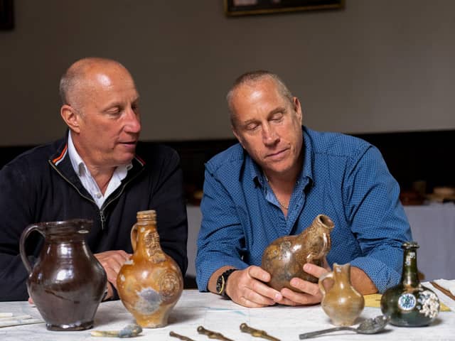 Brothers Julian and Lincoln Barnwell with some of the artefacts from the HMS Gloucester. Picture: UEA/PA Wire