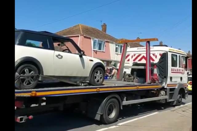 The Mini being taken away