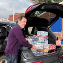 Rotarians Terry Dowland and Bob Mussellwhite, with boxes being checked and sent on their long festive journey to disadvantaged children overseas in time for Christmas.
