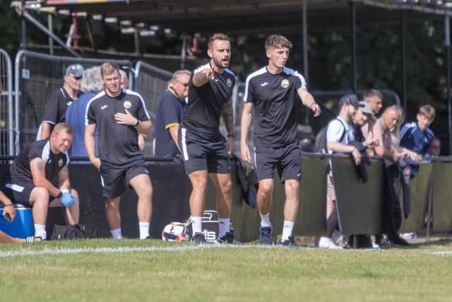 New Gosport bosses Pat Suraci, centre left, and Joe Lea during the friendly at former club Petersfield. Picture by Tom Phillips